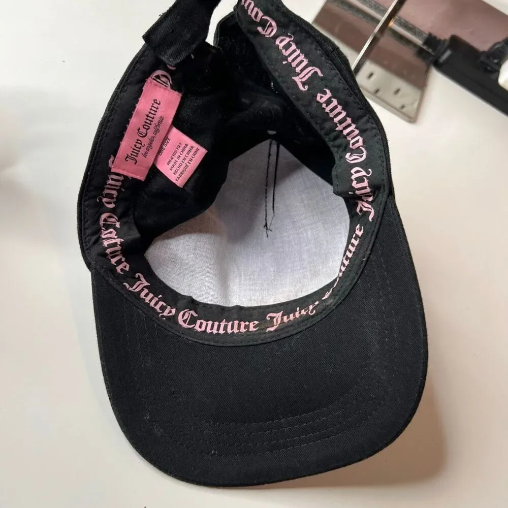This item is a black Juicy Couture baseball cap featuring a rhinestone logo